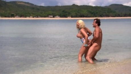 Busty babe Jemstone fucks a horny fellow on a secluded beach