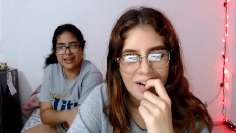 Two nerdy latinas playing with their pussies on cam